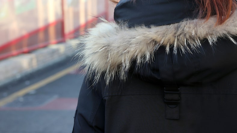 Back of woman in the street in winter