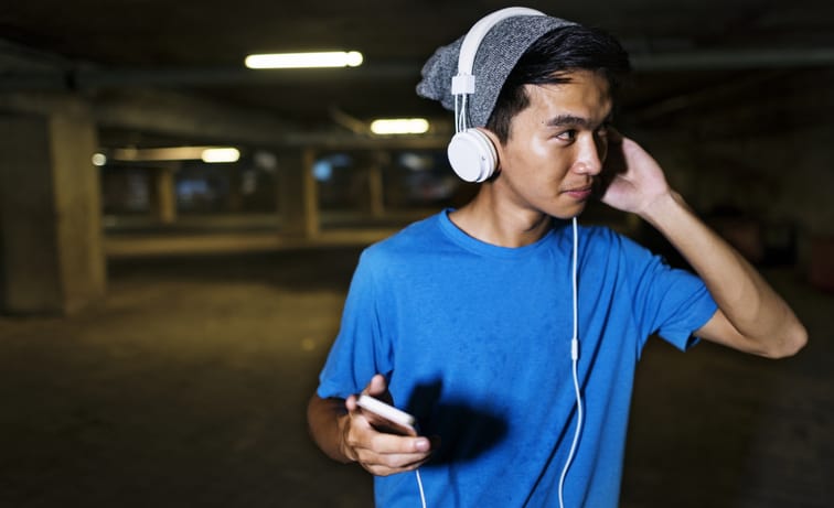 Young guy listening to music