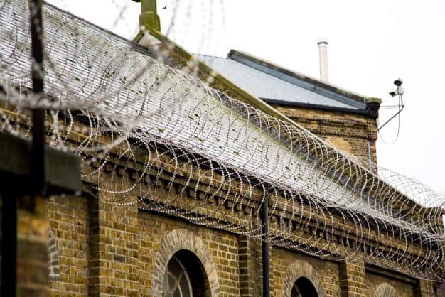 A building with barbed wire on top
