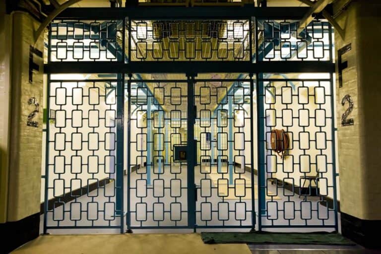 a gated entryway with a metal gate