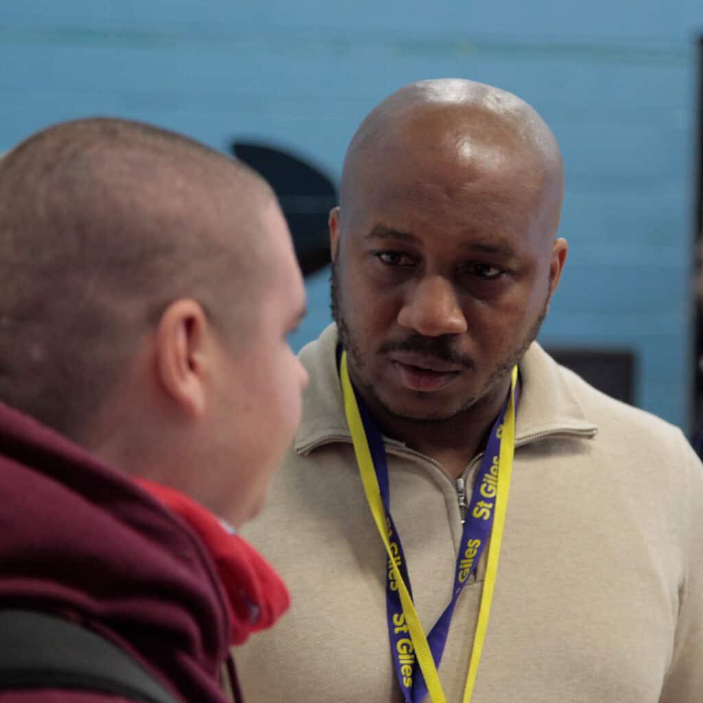 1 2 1 Mentoring Text Image A person talking to another person