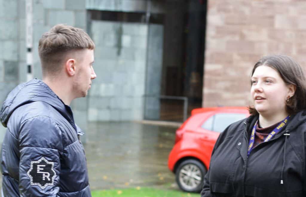 a man and woman standing outside