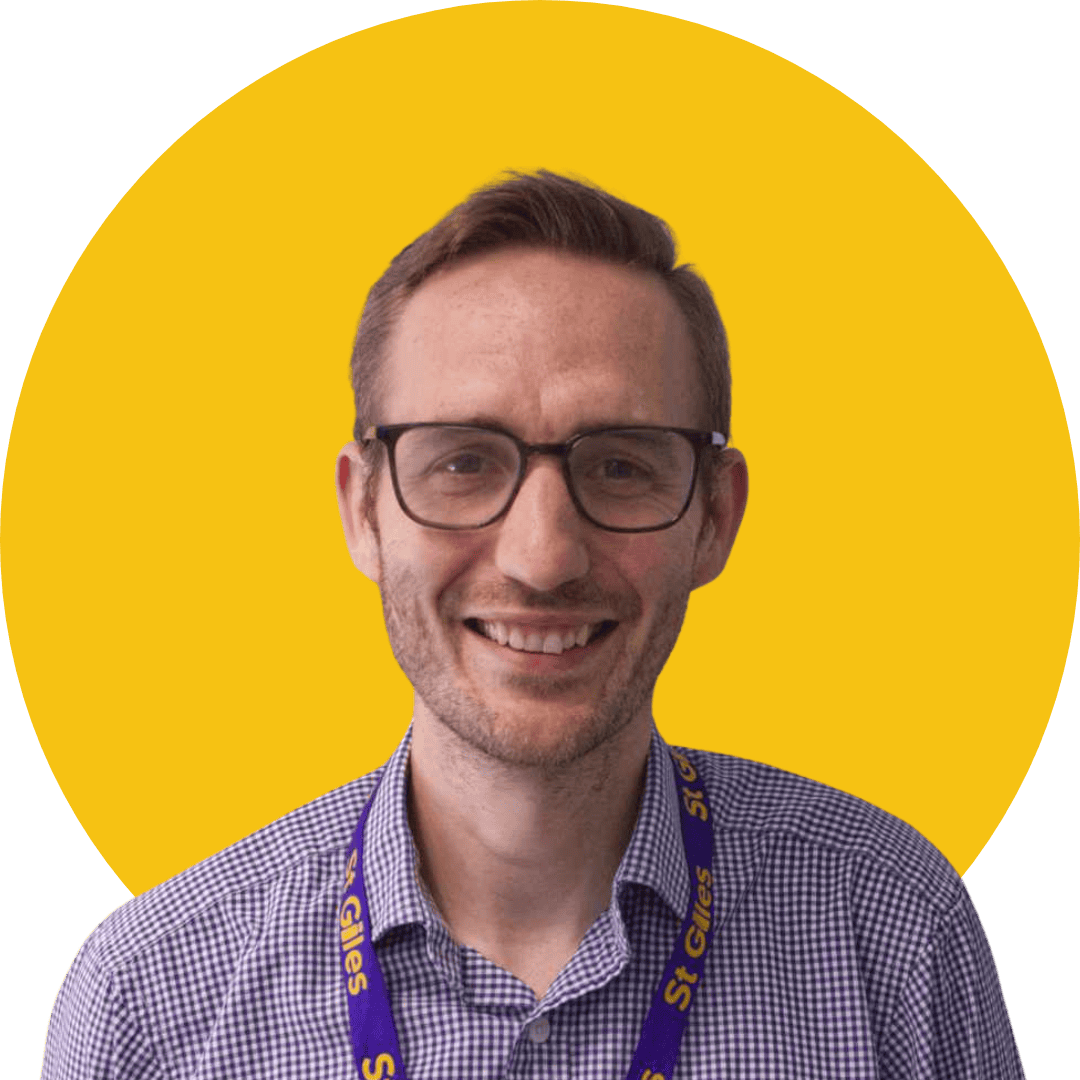 Untitled Design (41) Photograph of Nathan Srokosz with a yellow background.