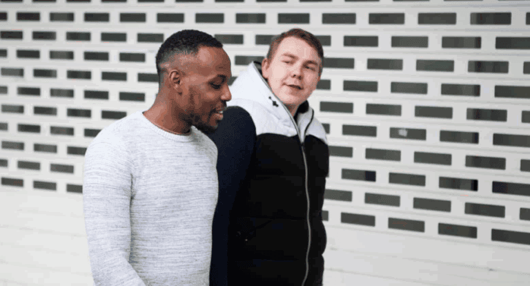 Two Men Walking Exterior